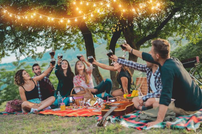 Group of people raising their glasses in a toast