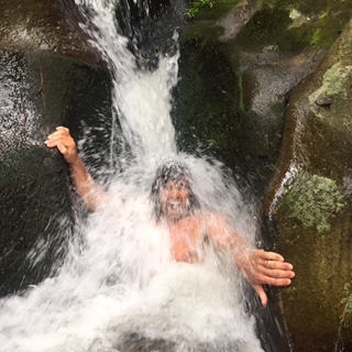 Man in a waterfall