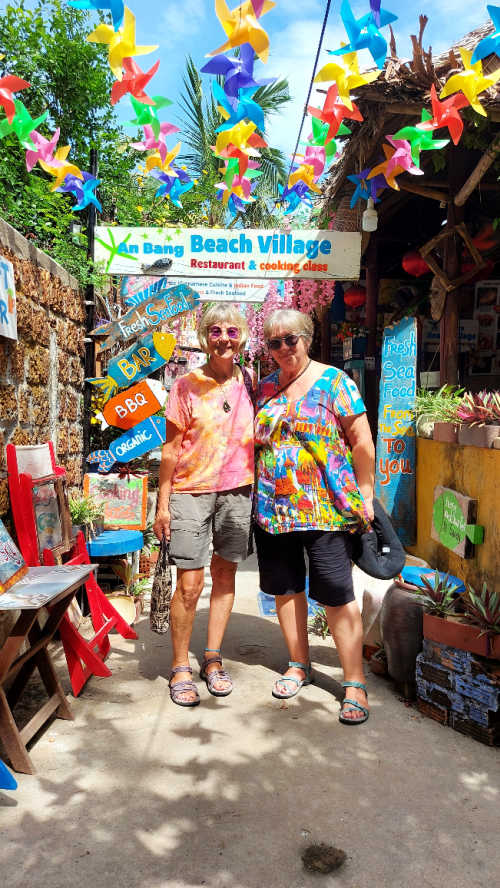 Rain and friend in colourful street cafe