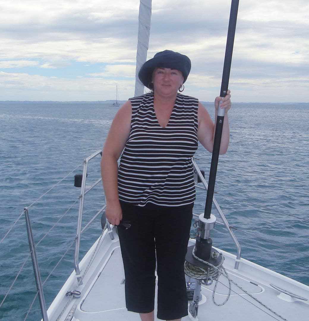 Lorraine at the helm of a sailing boat